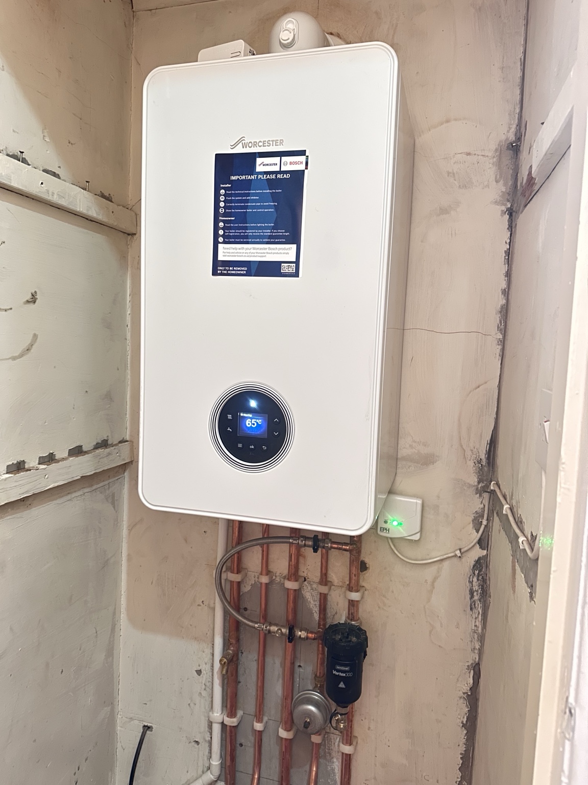 Domestic Worcester boiler installation with tidy copper pipework by Pomona Eco Solutions